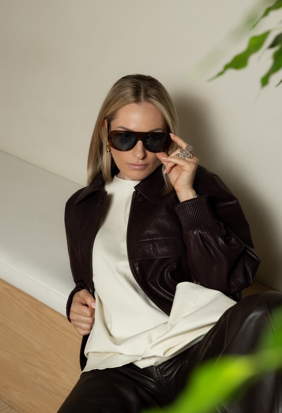 Lowering dark sunglasses in soft daylight